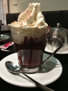 Venice with kids: hot chocolate and cream in a glass cup at a sports bar. Copyright©2015 reserved to photographer. Contact mapandfamily.com