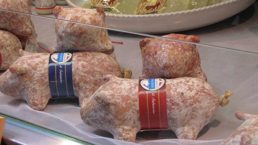Venice with teens: pig shaped salami in a shop display. Copyright©2015 reserved to photographer. Contact mapandfamily.com