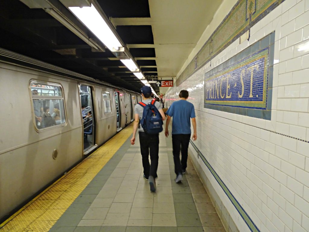 New York with teens: walking along a subway platform. Copyright©2015 reserved Nancy Roberts. Contact mapandfamily.com