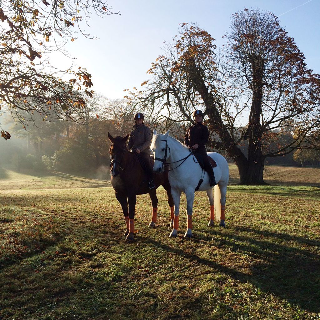 Two horses and riders in the grounds at Coworth Park hotel ©Coworth Park 