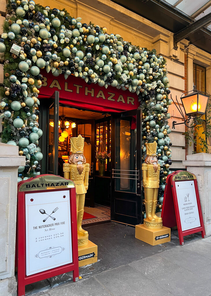 Baubles around doorway at Balthazar. Copyright@2024 mapandfamily.com